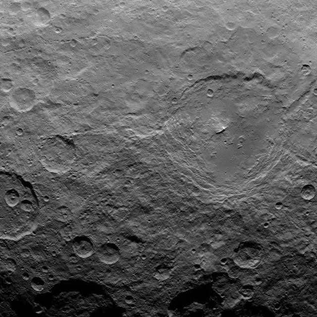 This image, taken by NASA's Dawn spacecraft, shows dwarf planet Ceres from an altitude of 2,700 miles (4,400 kilometers). The image, with a resolution of 1,400 feet (410 meters) per pixel, was taken on June 22, 2015.  http://photojournal.jpl.nasa.gov/catalog/PIA19591