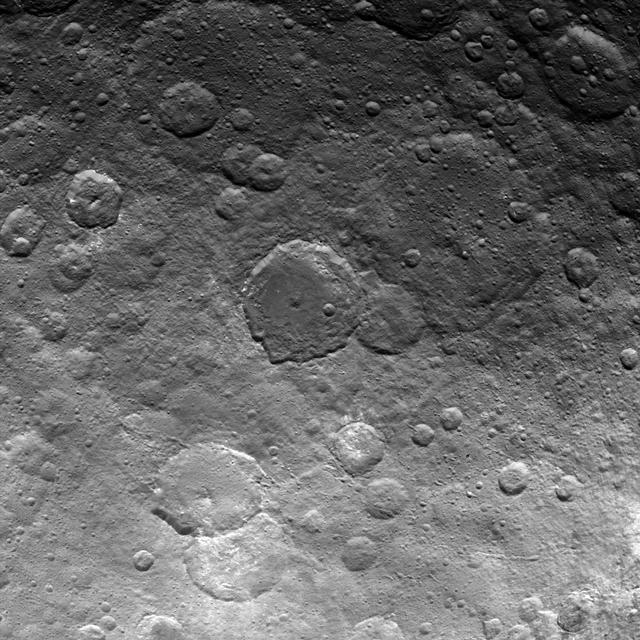 This image, taken by NASA's Dawn spacecraft, shows dwarf planet Ceres from an altitude of 2,700 miles (4,400 kilometers). The image, with a resolution of 1,400 feet (410 meters) per pixel, was taken on June 24, 2015.   http://photojournal.jpl.nasa.gov/catalog/PIA19594