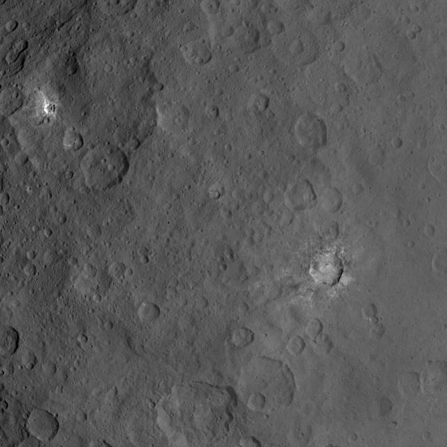 This image, taken by NASA's Dawn spacecraft, shows dwarf planet Ceres from an altitude of 2,700 miles (4,400 kilometers). The image, with a resolution of 1,400 feet (410 meters) per pixel, was taken on June 24, 2015.  http://photojournal.jpl.nasa.gov/catalog/PIA19595