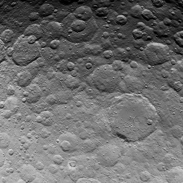 This image, taken by NASA's Dawn spacecraft, shows a portion of the northern hemisphere on dwarf planet Ceres from an altitude of 2,700 miles (4,400 kilometers). The image, with a resolution of 1,400 feet (410 meters) per pixel, was taken on June 24, 2015. The largest crater in this image, in the lower right quadrant, is called Ezinu. It is 75 miles (120 kilometers) across. http://photojournal.jpl.nasa.gov/catalog/PIA19610