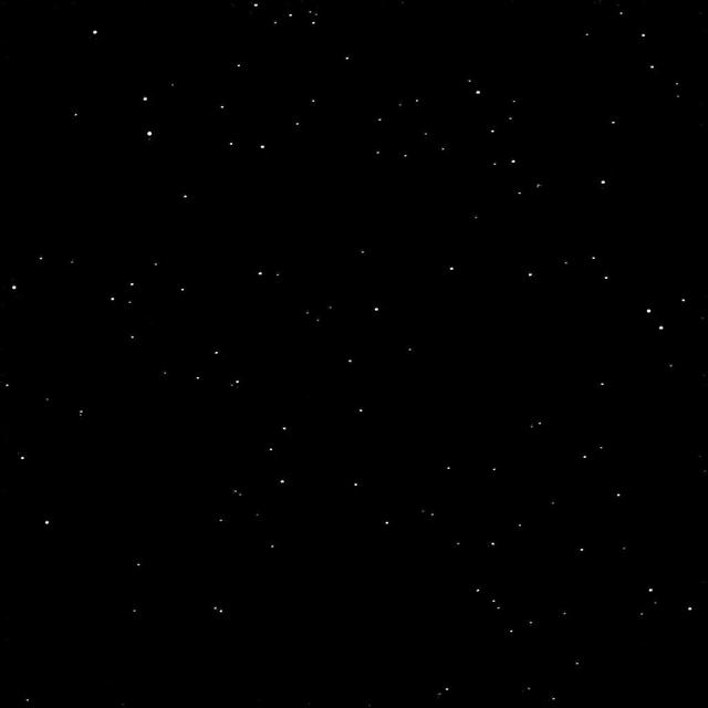 As one NASA spacecraft sailed past the distant ice world of Pluto, collecting never-before-seen vistas and invaluable science data, another spacecraft turned its gaze in that direction from its outpost at Saturn. NASA's Cassini spacecraft took a momentary break from its duties to capture this far-off portrait around the time of the New Horizons encounter with Pluto.  The image was taken within a few minutes of New Horizons' closest approach to Pluto. After New Horizons, Cassini was the closest spacecraft to Pluto at the time of the flyby.  Pluto is the bright dot closest to the center of the field of stars seen in this view. A labeled version of the image, indicating Pluto's position, is also presented here. The four stars identified in the labeled view have visual magnitudes between about 11 and 12.  The entire Pluto system -- the dwarf planet and all of its moons -- is below the resolution of this image, thus the small bright specks near the main dot representing Pluto are likely noise (possibly due to what astronomers call the point-spread function). Charon and the other moons would not be resolved at this scale.  The image was obtained using the Cassini spacecraft narrow-angle camera on July 14, 2015 at a distance of about 2.4 billion miles (3.9 billion kilometers) from Pluto.  http://photojournal.jpl.nasa.gov/catalog/PIA19641