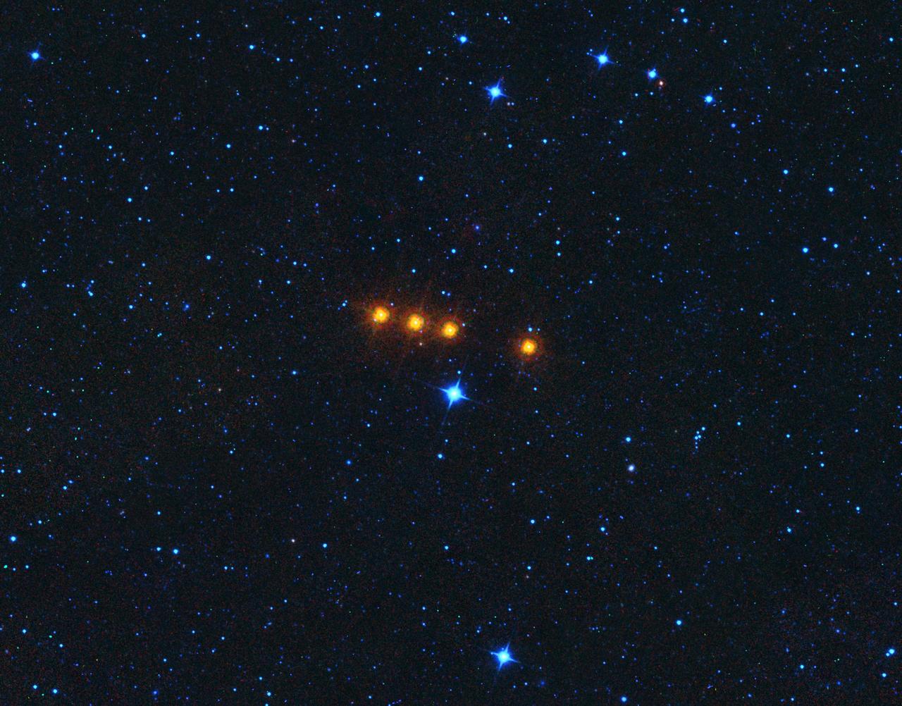 The asteroid Euphrosyne glides across a field of background stars in this time-lapse view from NASA's WISE spacecraft. WISE obtained the images used to create this view over a period of about a day around May 17, 2010, during which it observed the asteroid four times.  Because WISE (renamed NEOWISE in 2013) is an infrared telescope, it senses heat from asteroids. Euphrosyne is quite dark in visible light, but glows brightly at infrared wavelengths.  This view is a composite of images taken at four different infrared wavelengths: 3.4 microns (color-coded blue), 4.6 microns (cyan), 12 microns (green) and 22 microns (red).  The moving asteroid appears as a string of red dots because it is much cooler than the distant background stars. Stars have temperatures in the thousands of degrees, but the asteroid is cooler than room temperature. Thus the stars are represented by shorter wavelength (hotter) blue colors in this view, while the asteroid is shown in longer wavelength (cooler) reddish colors.  The WISE spacecraft was put into hibernation in 2011 upon completing its goal of surveying the entire sky in infrared light. WISE cataloged three quarters of a billion objects, including asteroids, stars and galaxies. In August 2013, NASA decided to reinstate the spacecraft on a mission to find and characterize more asteroids.  http://photojournal.jpl.nasa.gov/catalog/PIA19645