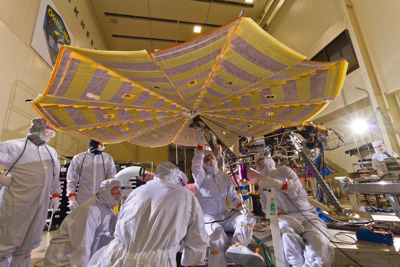 Engineers and technicians at Lockheed Martin Space Systems, Denver, run a test of deploying the solar arrays on NASA's InSight lander in this April 30, 2015 image. InSight, for Interior Exploration Using Seismic Investigations, Geodesy and Heat Transport, is scheduled for launch in March 2016 and landing in September 2016. It will study the deep interior of Mars to advance understanding of the early history of all rocky planets, including Earth. Note: After thorough examination, NASA managers have decided to suspend the planned March 2016 launch of the Interior Exploration using Seismic Investigations Geodesy and Heat Transport (InSight) mission. The decision follows unsuccessful attempts to repair a leak in a section of the prime instrument in the science payload. http://photojournal.jpl.nasa.gov/catalog/PIA19665