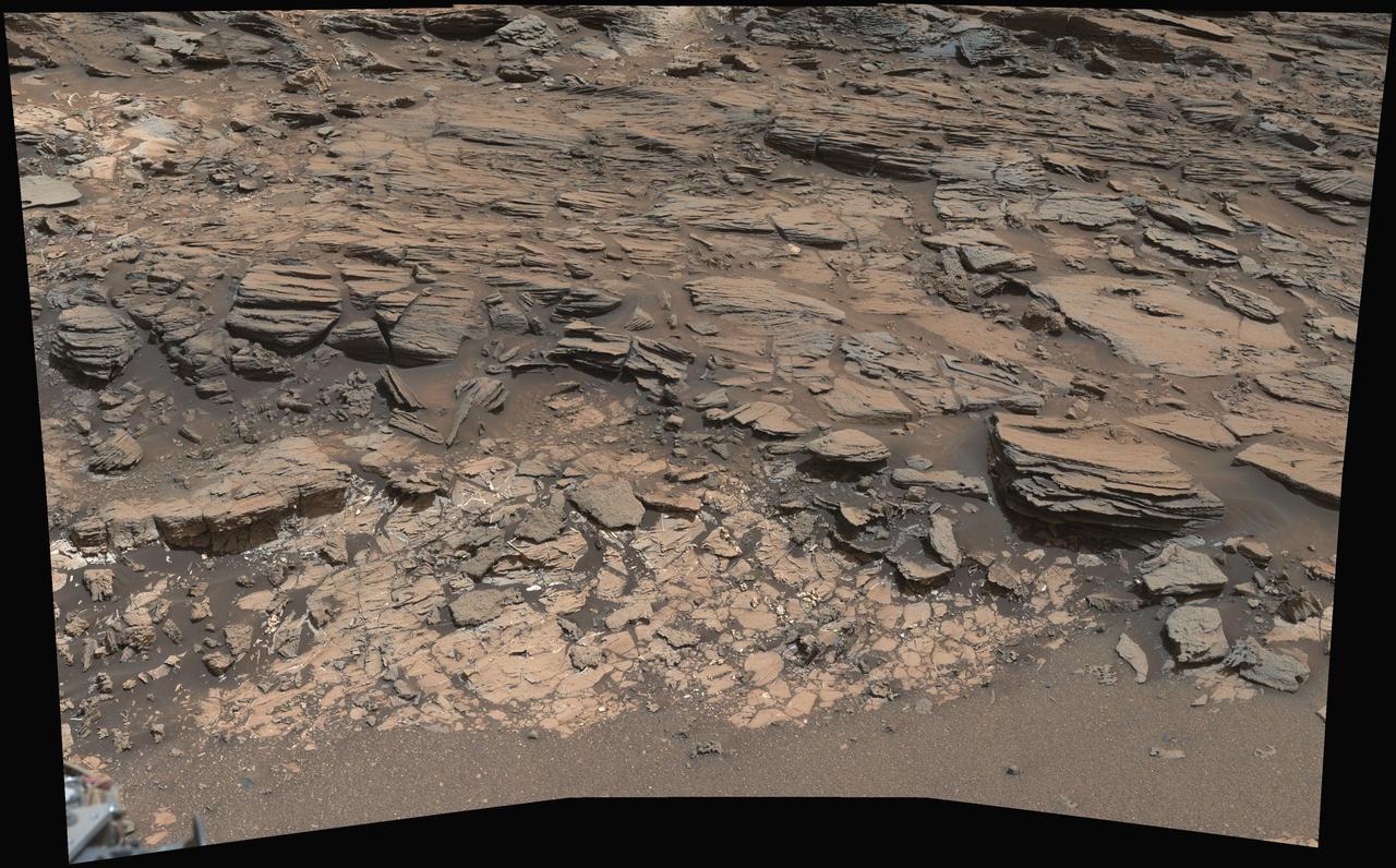 This view from the Mast Camera (Mastcam) on NASA's Curiosity Mars rover shows a site where two different types of bedrock meet on lower Mount Sharp.  The scene combines multiple images taken by the left-eye camera of Mastcam on May 25, 2015, during the 995th Martian day, or sol, of Curiosity's work on Mars, in a valley just below "Marias Pass." The color has been approximately white-balanced to resemble how the scene would appear under daytime lighting conditions on Earth.  The paler part of the outcrop, in the foreground, is mudstone similar to what Curiosity examined in 2014, and in early 2015, at "Pahrump Hills." The darker, finely bedded bedrock higher in the image and overlying the mudstone stratigraphically is sandstone that the rover team calls the "Stimson" unit.  The scene covers an area about 10 feet (3 meters) wide in the foreground.   Malin Space Science Systems, San Diego, built and operates the rover's Mastcam. NASA's Jet Propulsion Laboratory, a division of the California Institute of Technology, Pasadena, manages the Mars Science Laboratory Project for NASA's Science Mission Directorate, Washington.  http://photojournal.jpl.nasa.gov/catalog/PIA19676