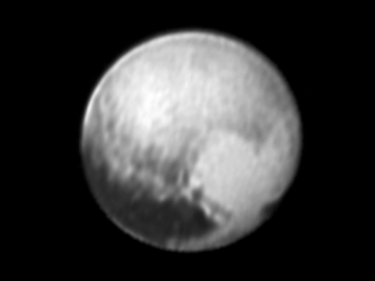 This image of Pluto was taken by New Horizons' Long Range Reconnaissance Imager (LORRI) at 4:18 UT on July 9, 2015, from a range of 3.9 million miles (6.3 million kilometers). It reveals new details on the surface of Pluto, including complex patterns in the transition between the very dark equatorial band (nicknamed "the whale"), which occupies the lower part of the image, and the brighter northern terrain. The bright arc at the bottom of the disk shows that there is more bright terrain beyond the southern margin of the "whale." The side of Pluto that will be studied in great detail during the close encounter on July 14 is now rotating off the visible disk on the right hand side, and will not be seen again until shortly before closest approach.  Three consecutive images were combined and sharpened, using a process called deconvolution, to create this view. Deconvolution enhances real detail but can also generate spurious features, including the bright edge seen on the upper and left margins of the disk (though the bright margin on the bottom of the disk is real).  The wireframe globe shows the orientation of Pluto in the image: thicker lines indicate the equator and the prime meridian (the direction facing Charon). Central longitude on Pluto is 86°.   http://photojournal.jpl.nasa.gov/catalog/PIA19705