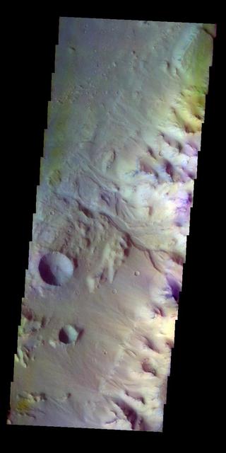 The THEMIS VIS camera contains 5 filters. The data from different filters can be combined in multiple ways to create a false color image. These false color images may reveal subtle variations of the surface not easily identified in a single band image. Today's false color image shows the margin between the highlands of Margaritifer Terra and Eos Chasma. An unnamed channel in the center of the image empties into the chasma. Orbit Number: 8191 Latitude: -10.784 Longitude: 322.952 Instrument: VIS Captured: 2003-10-19 19:20 http://photojournal.jpl.nasa.gov/catalog/PIA19730