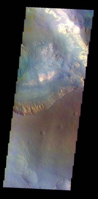 The THEMIS VIS camera contains 5 filters. The data from different filters can be combined in multiple ways to create a false color image. This image from NASA 2001 Mars Odyssey spacecraft shows part of Capri Mensa and Capri Chasma.