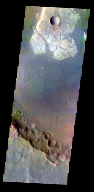 The THEMIS VIS camera contains 5 filters. The data from different filters can be combined in multiple ways to create a false color image. These false color images may reveal subtle variations of the surface not easily identified in a single band image. Today's false color image shows a unique, resistant material on the floor of an unnamed crater in Terra Cimmeria. Orbit Number: 8547 Latitude: -23.784 Longitude: 135.545 Instrument: VIS Captured: 2003-11-18 02:35 http://photojournal.jpl.nasa.gov/catalog/PIA19736