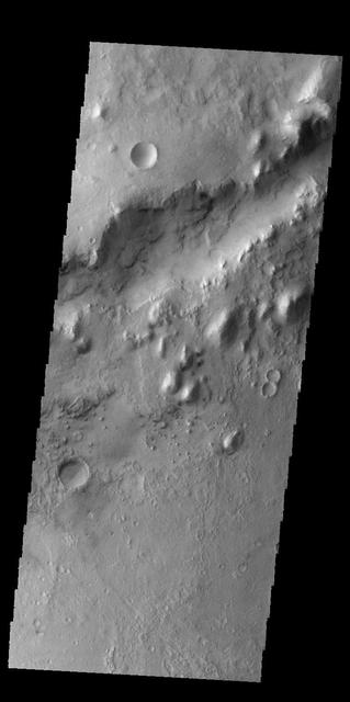 The linear depression in today's VIS image is part of Nili Fossae.  Orbit Number: 60318 Latitude: 24.7944 Longitude: 80.7404 Instrument: VIS Captured: 2015-07-20 08:53  http://photojournal.jpl.nasa.gov/catalog/PIA19763