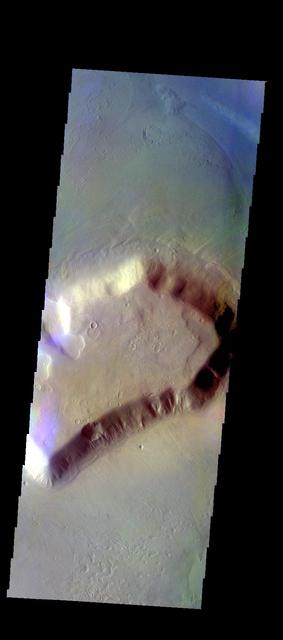 The THEMIS VIS camera contains 5 filters. The data from different filters can be combined in multiple ways to create a false color image. These false color images may reveal subtle variations of the surface not easily identified in a single band image. Today's false color image shows one of the many mesas that make up Deuteronilus Mensae. Orbit Number: 10809 Latitude: 42.6291 Longitude: 24.4723 Instrument: VIS Captured: 2004-05-22 09:54 http://photojournal.jpl.nasa.gov/catalog/PIA19772