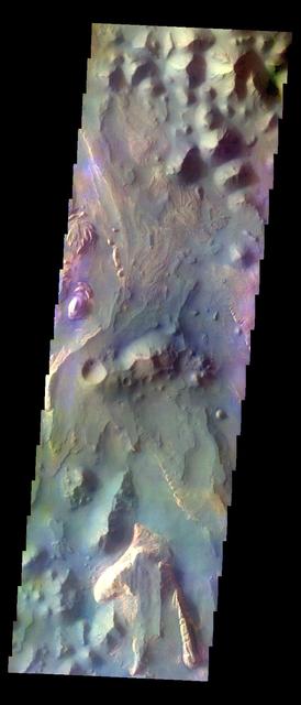 The THEMIS VIS camera contains 5 filters. The data from different filters can be combined in multiple ways to create a false color image. These false color images may reveal subtle variations of the surface not easily identified in a single band image. Today's false color image shows part of Aureum Chaos. Orbit Number: 10849 Latitude: -3.61061 Longitude: 332.761 Instrument: VIS Captured: 2004-05-25 15:14 http://photojournal.jpl.nasa.gov/catalog/PIA19774