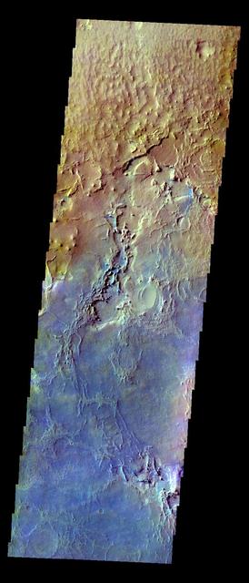 The THEMIS VIS camera contains 5 filters. The data from different filters can be combined in multiple ways to create a false color image. These false color images may reveal subtle variations of the surface not easily identified in a single band image. Today's false color image shows part of Arabia Terra. A dark blue tone in this false color image is often associated with basaltic sand. Orbit Number: 12307 Latitude: 3.44332 Longitude: 5.97644 Instrument: VIS Captured: 2004-09-22 18:11 http://photojournal.jpl.nasa.gov/catalog/PIA19794