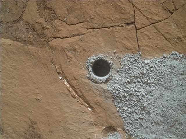 NASA's Curiosity Mars Rover drilled this hole to collect sample material from a rock target called "Buckskin" on July 30, 2015, during the 1060th Martian day, or sol, of the rover's work on Mars. The diameter is slightly smaller than a U.S. dime.  Curiosity landed on Mars on Aug. 6, 2012, Universal Time (evening of Aug. 5, PDT).  The rover took this image with the Mars Hand Lens Imager (MAHLI) camera, which is mounted on the same robotic arm as the sample-collecting drill. Rock powder from the collected sample was subsequently delivered to a laboratory inside the rover for analysis. The rover's drill did not experience any sign during this sample collection of an intermittent short-circuiting issue that was detected earlier in 2015.  The Buckskin target is in an area near "Marias Pass" on lower Mount Sharp where Curiosity had detected unusually high levels of silica and hydrogen.  MAHLI was built by Malin Space Science Systems, San Diego. NASA's Jet Propulsion Laboratory, a division of the California Institute of Technology in Pasadena, manages the Mars Science Laboratory Project for the NASA Science Mission Directorate, Washington. JPL designed and built the project's Curiosity rover.   http://photojournal.jpl.nasa.gov/catalog/PIA19804