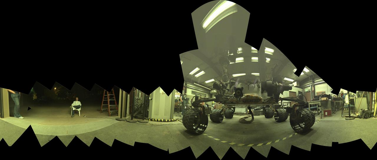This view of a test rover at NASA's Jet Propulsion Laboratory, Pasadena, California, results from advance testing of arm positions and camera pointings for taking a low-angle self-portrait of NASA's Curiosity Mars rover.  This rehearsal in California led to a dramatic Aug. 5, 2015, selfie of Curiosity, online at PIA19807. Curiosity's arm-mounted Mars Hand Lens Imager (MAHLI) camera took 92 of component images that were assembled into that mosaic. The rover team positioned the camera lower in relation to the rover body than for any previous full self-portrait of Curiosity.  This practice version was taken at JPL's Mars Yard in July 2013, using the Vehicle System Test Bed (VSTB) rover, which has a test copy of MAHLI on its robotic arm.  MAHLI was built by Malin Space Science Systems, San Diego. JPL, a division of the California Institute of Technology in Pasadena, manages the Mars Science Laboratory Project for the NASA Science Mission Directorate, Washington. JPL designed and built the project's Curiosity rover.  http://photojournal.jpl.nasa.gov/catalog/PIA19810