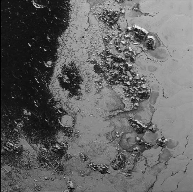 A newly discovered mountain range lies near the southwestern margin of Pluto heart-shaped Tombaugh Regio Tombaugh Region, situated between bright, icy plains and dark, heavily-cratered terrain.  This image was acquired by NASA's New Horizons' Long Range Reconnaissance Imager (LORRI) on July 14, 2015, from a distance of 48,000 miles (77,000 kilometers) and sent back to Earth on July 20. Features as small as a half-mile (1 kilometer) across are visible.  These frozen peaks are estimated to be one-half mile to one mile (1-1.5 kilometers) high, about the same height as the United States' Appalachian Mountains. The Norgay Montes (Norgay Mountains) discovered by New Horizons on July 15 more closely approximate the height of the taller Rocky Mountains  The names of features on Pluto have all been given on an informal basis by the New Horizons team.   http://photojournal.jpl.nasa.gov/catalog/PIA19842