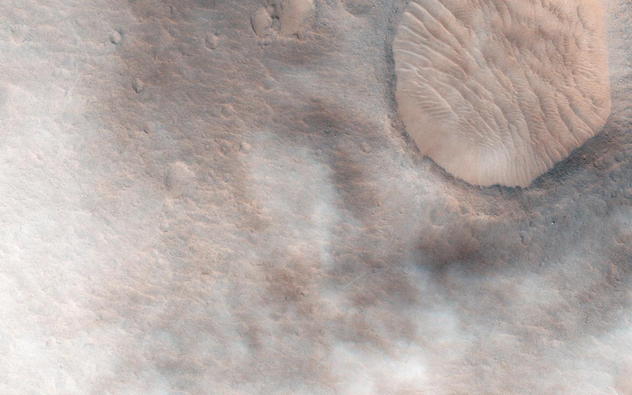 This observation from NASA Mars Reconnaissance Orbite shows a candidate 2018 European Space Agency ExoMars landing site in Hypanis Vallis. Instead of imaging ancient fluvial deposits (thought to be the remnants of a delta feed lake), the image shows patchy concentrations of dust clouds. These clouds are part of the annually occurring Acidalia storm track, a regional dust storm system that originates in the Acidalia-Chryse-Kasei region and propagates southward into equatorial Valles Marineris and beyond. While this image is only partially obscured by dust, many others captured around this time frame were completely dominated by think clouds of dust. For example, this image in Capri Chasma was rendered useless for geology and will have to be reacquired. Landing by the ExoMars rover in these kinds of atmospheric conditions would be complicated. That mission is set to touchdown on Mars in January 2019, hopefully with clear skies. HiRISE will continue to image Hypanis Vallis and other interesting sites on Mars despite the changing weather. http://photojournal.jpl.nasa.gov/catalog/PIA19846