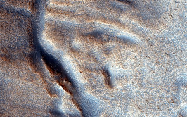 NASA image: A Fresh Shallow Valley Transitions to an Inverted Channel