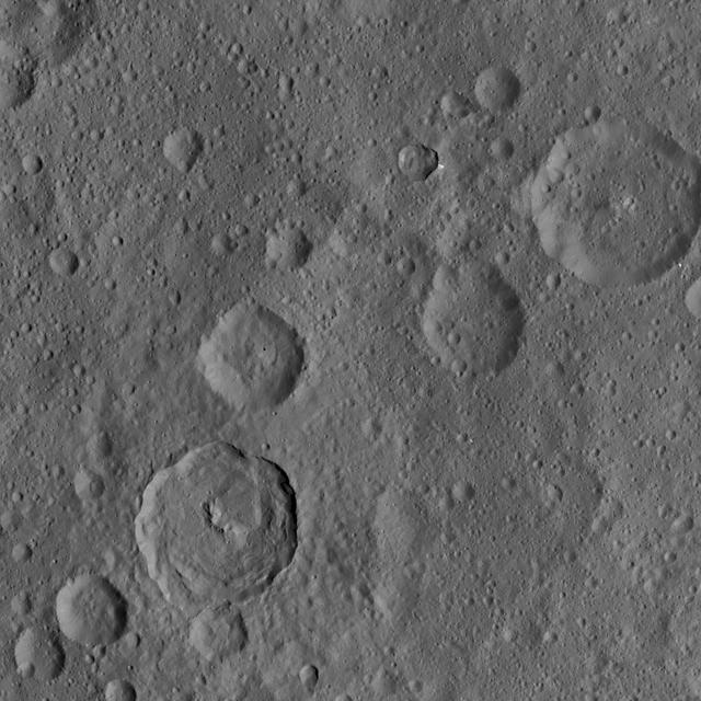 This image, taken by NASA's Dawn spacecraft, shows the surface of dwarf planet Ceres from an altitude of 915 miles (1,470 kilometers). The image, with a resolution of 450 feet (140 meters) per pixel, was taken on August 24, 2015.  http://photojournal.jpl.nasa.gov/catalog/PIA19893