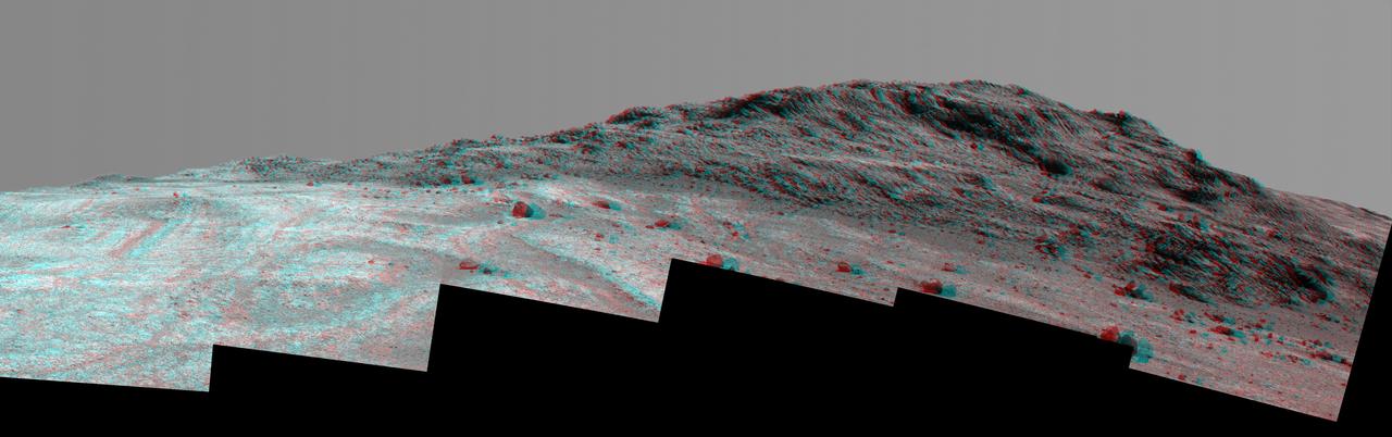This 3-D stereo view from NASA Mars rover Opportunity shows contrasting textures and colors of Hinners Point, at the northern edge of Marathon Valley, and swirling reddish zones on the valley floor to the left.