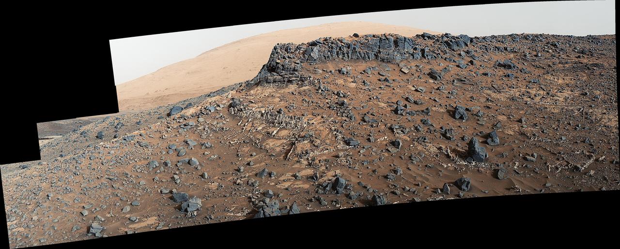 This view from the Mast Camera (Mastcam) on NASA's Curiosity Mars rover shows a site with a network of prominent mineral veins below a cap rock ridge on lower Mount Sharp.  Researchers used the rover in March 2015 to examine the structure and composition of the crisscrossing veins at the "Garden City" site in the center of this scene. For geologists, the vein complex offers a three-dimensional exposure of mineralized fractures in a geological setting called the Pahrump section of the Lower Murray Formation. Curiosity spent several months examining sites in the Pahrump section below this site, before arriving at Garden City.  Mineral veins such as these form where fluids move through fractured rocks, depositing minerals in the fractures and affecting chemistry of the surrounding rock. In this case, the veins have been more resistant to erosion than the surrounding host rock.  The component images of this mosaic view were taken by the left-eye camera of Mastcam on March 27, 2015, during the 938th Martian day, or sol, of Curiosity's work on Mars. The scene is presented with a color adjustment that approximates white balancing, to resemble how the rocks would appear under daytime lighting conditions on Earth.  For scale, the cap rock scarp is about 3 feet (1 meter) tall.  Figure 1 includes scale bars of 1 meter (3.3 feet) vertically and 2 meters (6.7 feet) horizontally.  Malin Space Science Systems, San Diego, built and operates Curiosity's Mastcam. NASA's Jet Propulsion Laboratory, a division of the California Institute of Technology, Pasadena, built the rover and manages the project for NASA's Science Mission Directorate, Washington.  http://photojournal.jpl.nasa.gov/catalog/PIA19921