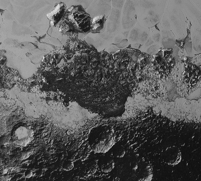 This 220-mile (350-kilometer) wide view of Pluto from NASA's New Horizons spacecraft illustrates the incredible diversity of surface reflectivities and geological landforms on the dwarf planet. The image includes dark, ancient heavily cratered terrain; bright, smooth geologically young terrain; assembled masses of mountains; and an enigmatic field of dark, aligned ridges that resemble dunes; its origin is under debate. The smallest visible features are 0.5 miles (0.8 kilometers) in size. This image was taken as New Horizons flew past Pluto on July 14, 2015, from a distance of 50,000 miles (80,000 kilometers).  http://photojournal.jpl.nasa.gov/catalog/PIA19933