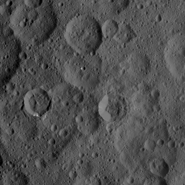 This image of Ceres, taken by NASA's Dawn spacecraft, shows a densely cratered region centered at 48 degrees north latitude, 286 degrees east longitude. The craters in the image are characterized by different degrees of freshness, reflecting different ages. The sharply defined crater to right of center is named Takel, after the Malaysian goddess in charge of the tuber harvest. Takel has a diameter of 13 miles (21 kilometers) and features a narrow tongue-like deposit extending outward from its lower rim. Dawn took this image on Oct. 1, 2015, from an altitude of 915 miles (1,470 kilometers). It has a resolution of 450 feet (140 meters) per pixel. http://photojournal.jpl.nasa.gov/catalog/PIA19997