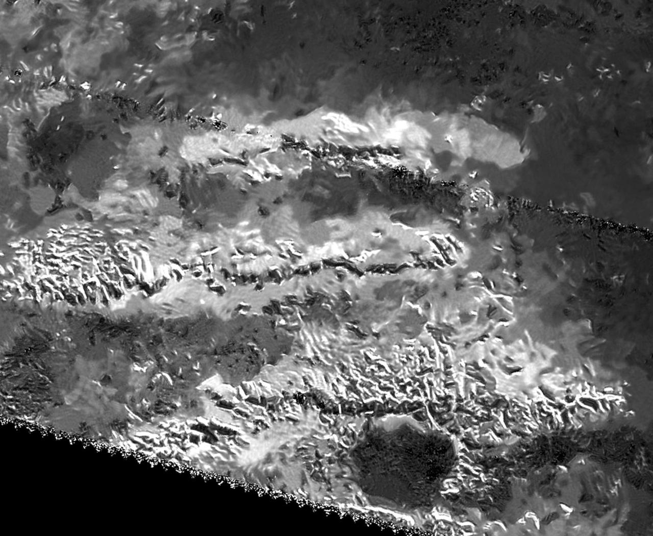 The trio of ridges on Titan known as Mithrim Montes is home to the hazy Saturnian moon tallest peak. The mountain is located midway along the lower of the three ridges shown in this radar image from NASA Cassini spacecraft.