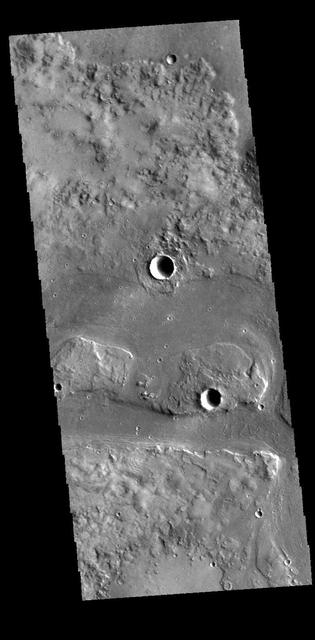 Today's VIS image shows a portion of Granicus Valles. This channel system is located west of Elysium Mons and likely was created by both lava and water flow related to the Elysium Mons volcanic complex. Orbit Number: 61084 Latitude: 28.5697 Longitude: 129.782 Instrument: VIS Captured: 2015-09-21 10:03 http://photojournal.jpl.nasa.gov/catalog/PIA20098