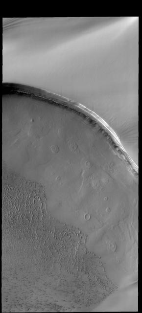 Tenuis Cavus is a region within the north polar cap where the underlying surface is visible. Ice comprises the top part of this image captured by NASA 2001 Mars Odyssey spacecraft. Orbit Number: 61283 Latitude: 84.7719 Longitude: 2.80914 Instrument: VIS Captured: 2015-10-07 19:42 http://photojournal.jpl.nasa.gov/catalog/PIA20112