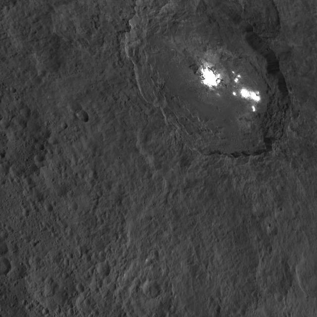 One of the most intriguing features on Ceres, Occator crater, is seen in this oblique view from NASA's Dawn spacecraft. This crater is 60 miles (90 kilometers) across and 2 miles (4 kilometers) deep, and is home to the brightest areas on Ceres.  This image was acquired from an altitude of 915 miles (1,470 kilometers). Dawn took this image on Oct. 18, 2015.  http://photojournal.jpl.nasa.gov/catalog/PIA20132