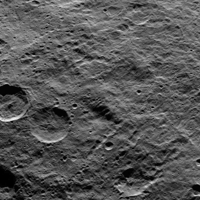 Part of the southern hemisphere on dwarf planet Ceres is seen in this image taken by NASA Dawn spacecraft. Two prominent, similarly sized craters at left demonstrate how impact features become degraded over time.  The leftmost of the pair is younger; its rim is crisp and its walls are generally smooth, peppered with only a few small craters. Its older twin, to its right, has been battered by more impacts, and the material around its rim has slumped and softened. In fact, the blanket of material ejected from the younger crater, during its formation, would have partly covered its older neighbor. Planetary scientists call this slow, progressive changing of the surface of planetary bodies by cratering "impact gardening."  Dawn took this image on Oct. 15, 2015, from an altitude of 915 miles (1,470 kilometers). It has a resolution of 450 feet (140 meters) per pixel.  http://photojournal.jpl.nasa.gov/catalog/PIA20135