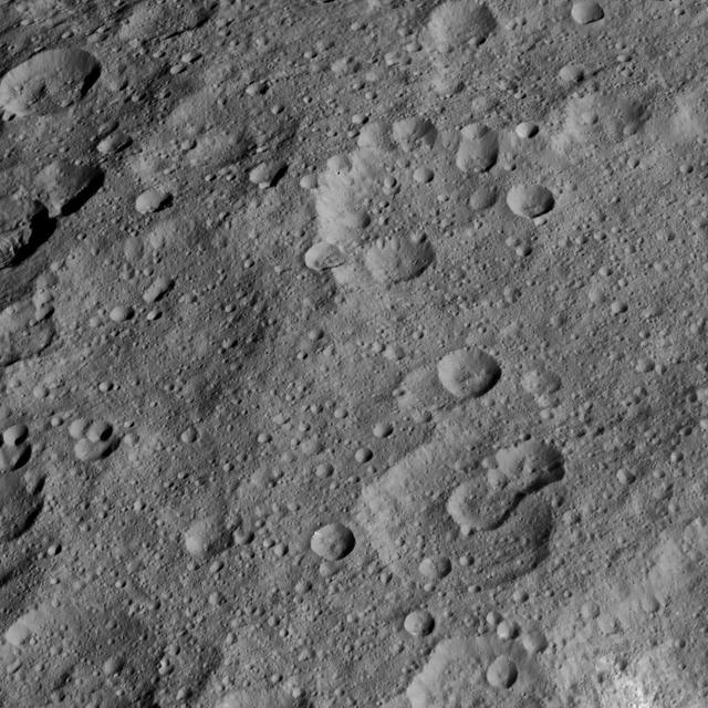 This view from NASA Dawn spacecraft shows high northern latitudes on Ceres. Dawn acquired the image on Oct. 17, 2015, from an altitude of 915 miles 1,470 kilometers. It has a resolution of 450 feet 140 meters per pixel.  http://photojournal.jpl.nasa.gov/catalog/PIA20138