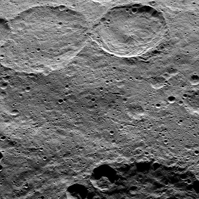 This image of Ceres, taken by NASA's Dawn spacecraft, shows Sintana Crater (36 miles, 58 kilometers wide) at top, just right of center. The rim of a large crater called Zadeni (80 miles, 128 kilometers wide), is seen at the bottom of the image.  Dawn took this image from an altitude of 915 miles (1,470 kilometers) during its High Altitude Mapping Orbit (HAMO) phase on Oct. 20, 2015. Image resolution is 450 feet (140 meters) per pixel.  The scene is located in the southern hemisphere of Ceres at approximately 55 degrees south latitude, 40 degrees east longitude.   http://photojournal.jpl.nasa.gov/catalog/PIA20149