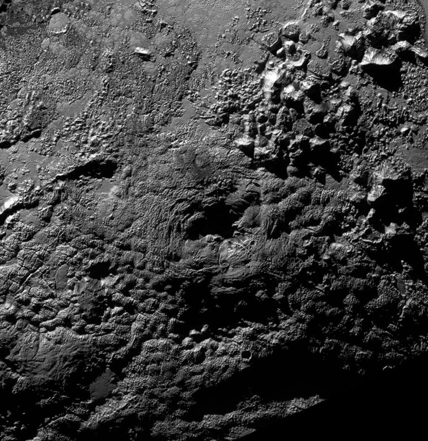 NASA New Horizons scientists believe that the informally named feature Wright Mons, located south of Sputnik Planum on Pluto, and another, Piccard Mons, could have been formed by the cryovolcanic eruption of ices from beneath Pluto surface.