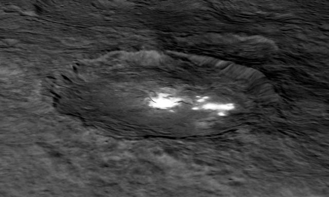 An image of Occator Crater draped over a digital terrain model provides a 3-D-like perspective view of the impact structure. Several bright areas can be seen in this crater. The inner part of the crater forms a type of "crater within a crater" measuring about 6 miles (10 kilometers) in diameter and 0.3 miles (0.5 miles) in depth, and contains the brightest material on all of Ceres. Occator measures about 60 miles (90 kilometers) wide. With its sharp rim and walls, and abundant terraces and landslide deposits, Occator appears to be among the youngest features on Ceres. Dawn mission scientists estimate its age to be about 78 million years old. http://photojournal.jpl.nasa.gov/catalog/PIA20179