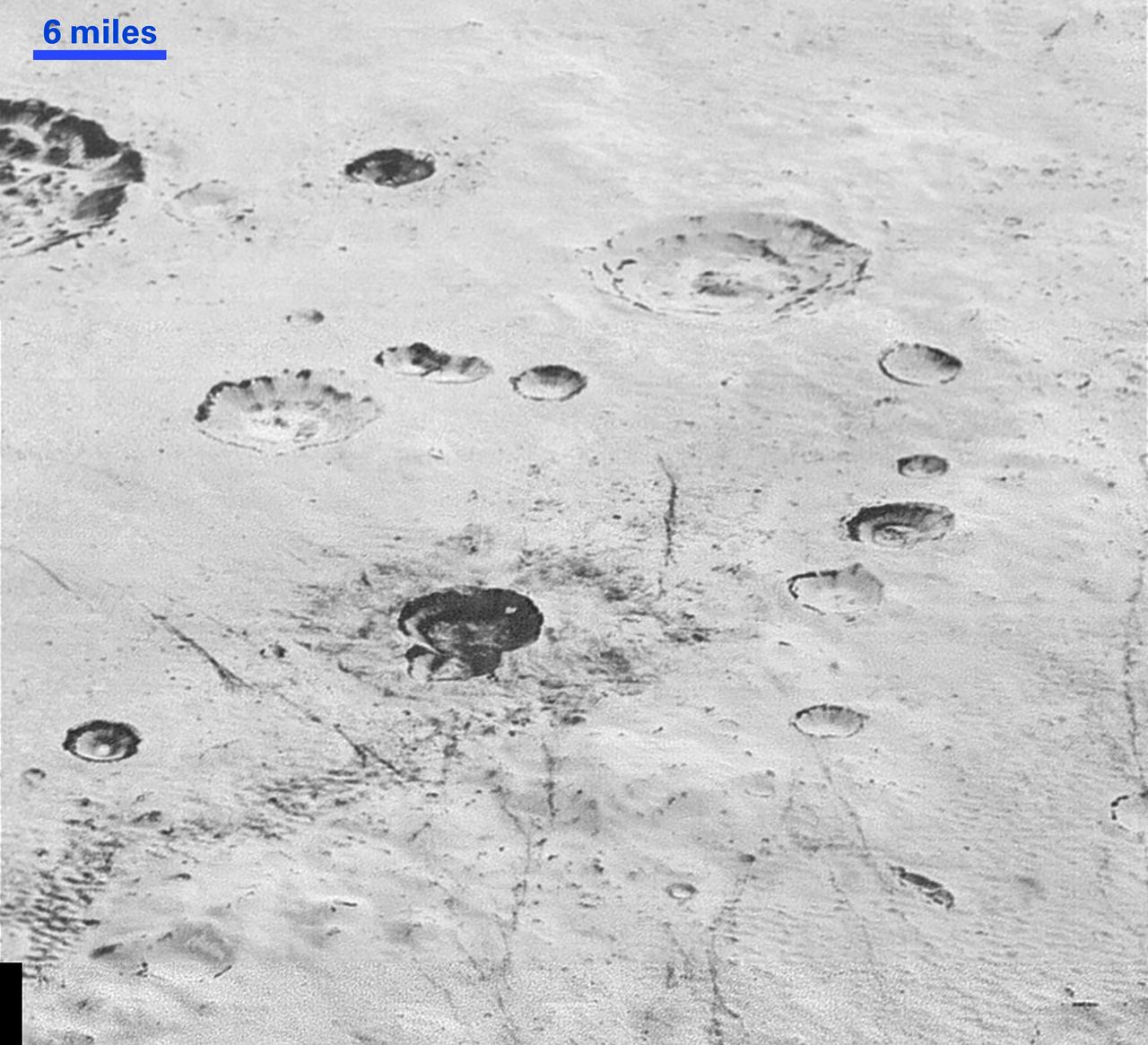 This highest-resolution image from NASA's New Horizons spacecraft reveals new details of Pluto's rugged, icy cratered plains. Notice the layering in the interior walls of many craters (the large crater at upper right is a good example) -- layers in geology usually mean an important change in composition or event but at the moment New Horizons team members do not know if they are seeing local, regional or global layering. The darker crater in the lower center is apparently younger than the others, because dark material ejected from within -- its "ejecta blanket" -- have not been erased and can still be made out. The origin of the many dark linear features trending roughly vertically in the bottom half of the image is under debate, but may be tectonic. Most of the craters seen here lie within the 155-mile (250-kilometer)-wide Burney Basin, whose outer rim or ring forms the line of hills or low mountains at bottom. The basin is informally named after Venetia Burney, the English schoolgirl who first proposed the name "Pluto" for the newly discovered planet in 1930. The top of the image is to Pluto's northwest. These images were made with the telescopic Long Range Reconnaissance Imager (LORRI) aboard New Horizons, in a timespan of about a minute centered on 11:36 UT on July 14 -- just about 15 minutes before New Horizons' closest approach to Pluto-- from a range of just 10,000 miles (17,000 kilometers). They were obtained with an unusual observing mode; instead of working in the usual "point and shoot," LORRI snapped pictures every three seconds while the Ralph/Multispectral Visual Imaging Camera (MVIC) aboard New Horizons was scanning the surface. This mode requires unusually short exposures to avoid blurring the images. http://photojournal.jpl.nasa.gov/catalog/PIA20200