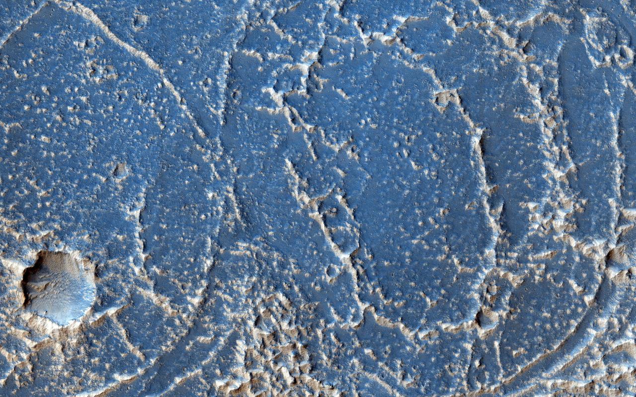 This image shows bright and dark patterns with curving boundaries, a good example of Mars art. What caused this appearance?  This region of Echus Chasma has been flooded by lava flows that produced rough and smooth surfaces. The rough areas then trap bright dust, creating the contrasts in brightness.   http://photojournal.jpl.nasa.gov/catalog/PIA20209