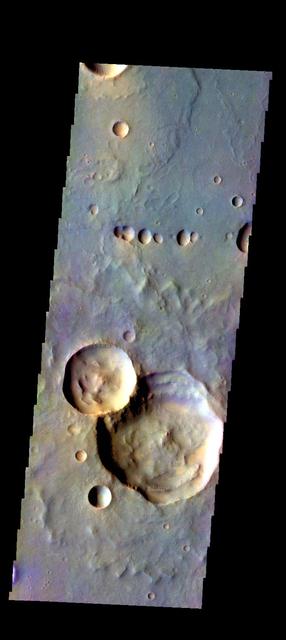 The THEMIS camera contains 5 filters. The data from different filters can be combined in multiple ways to create a false color image. These false color images may reveal subtle variations of the surface not easily identified in a single band image. Today's false color images shows part of Ophir Planum. Orbit Number: 17901 Latitude: -9.97494 Longitude: 303.278 Instrument: VIS Captured: 2005-12-27 06:04. http://photojournal.jpl.nasa.gov/catalog/PIA20226