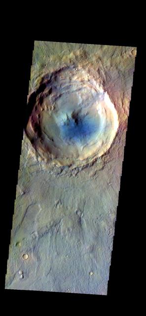 The THEMIS camera contains 5 filters. The data from different filters can be combined in multiple ways to create a false color image. These false color images may reveal subtle variations of the surface not easily identified in a single band image. Today's false color images shows an unnamed crater in Acidalia Planitia. The "dark blue" material is likely basaltic sand. Orbit Number: 19321 Latitude: 42.1856 Longitude: 359.705 Instrument: VIS Captured: 2006-04-23 05:40 http://photojournal.jpl.nasa.gov/catalog/PIA20231
