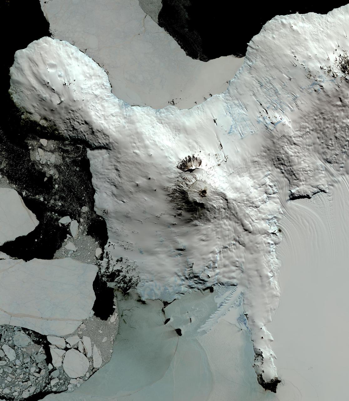 This image from NASA Terra spacecraft shows Mount Erebus, the world southernmost historically active volcano, overlooking the McMurdo research station on Ross Island. The 3794-m-high Erebus is the largest of three major volcanoes forming the crudely triangular Ross Island. An elliptical 500 x 600 m wide, 110-m-deep crater truncates the summit and contains an active lava lake within a 250-m-wide, 100-m-deep inner crater. The glacier-covered volcano was erupting when first sighted by Captain James Ross in 1841. Continuous lava-lake activity with minor explosions, punctuated by occasional larger strombolian explosions that eject bombs onto the crater rim, has been documented since 1972, but has probably been occurring for much of the volcano's recent history. The image was acquired December 31, 2013, covers an area of 63 x 73 km, and is located at 77.5 degrees south, 167.1 degrees east.   http://photojournal.jpl.nasa.gov/catalog/PIA20239