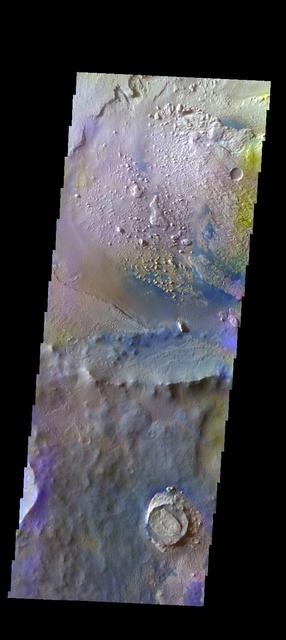 The THEMIS VIS camera contains 5 filters. The data from different filters can be combined in multiple ways to create a false color image. These false color images may reveal subtle variations of the surface not easily identified in a single band image. Today's false color image shows an unnamed crater located on the floor of the much larger Schiaparelli Crater. The dark blue material located in the topographic lows is basaltic sand. Orbit Number: 19495 Latitude: -0.402445 Longitude: 14.3131 Instrument: VIS Captured: 2006-05-07 13:43 http://photojournal.jpl.nasa.gov/catalog/PIA20244
