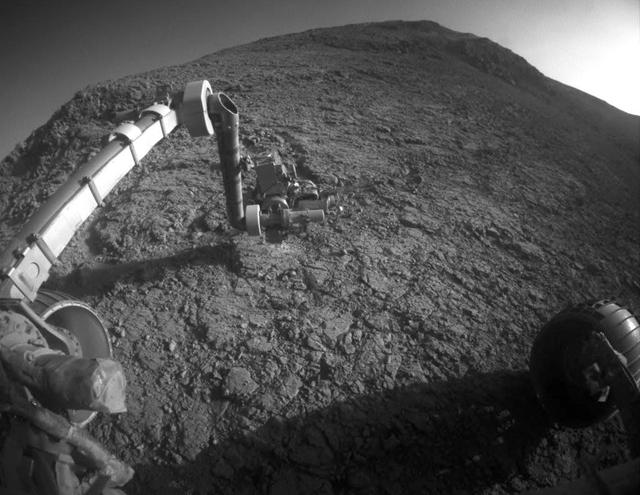 The target beneath the tool turret at the end of the rover's robotic arm in this image from NASA's Mars Exploration Rover Opportunity is "Private John Potts." It lies high on the southern side of "Marathon Valley," which slices through the western rim of Endeavour Crater.  The target's informal name refers to a member of the Lewis and Clark Expedition's Corps of Discovery.  The image was taken by Opportunity's front hazard avoidance camera on Jan. 5, 2016, during the 4,248th Martian day, or sol, of the rover's work on Mars. This camera is mounted low on the rover and has a wide-angle lens.  In this image, the microscopic imager on the turret is pointed downward. Opportunity's examination of this target also used the turret's rock abrasion tool for removing the surface crust and alpha particle X-ray spectrometer for identifying chemical elements in the rock.   http://photojournal.jpl.nasa.gov/catalog/PIA20285