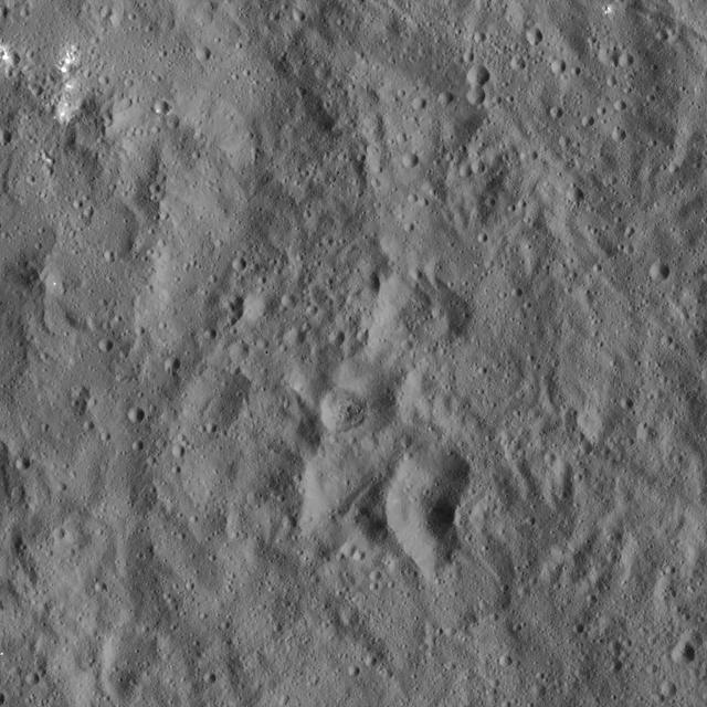 Flecks of bright material can be seen in this image of Ceres, taken by NASA's Dawn spacecraft. The view is centered at approximately 13.7 degrees north latitude, 144 degrees east longitude.  Dawn took this image on Dec. 19, 2015, from its low-altitude mapping orbit (LAMO), at an approximate altitude of 240 miles (385 kilometers) above Ceres. The image resolution is 120 feet (35 meters) per pixel.  http://photojournal.jpl.nasa.gov/catalog/PIA20298