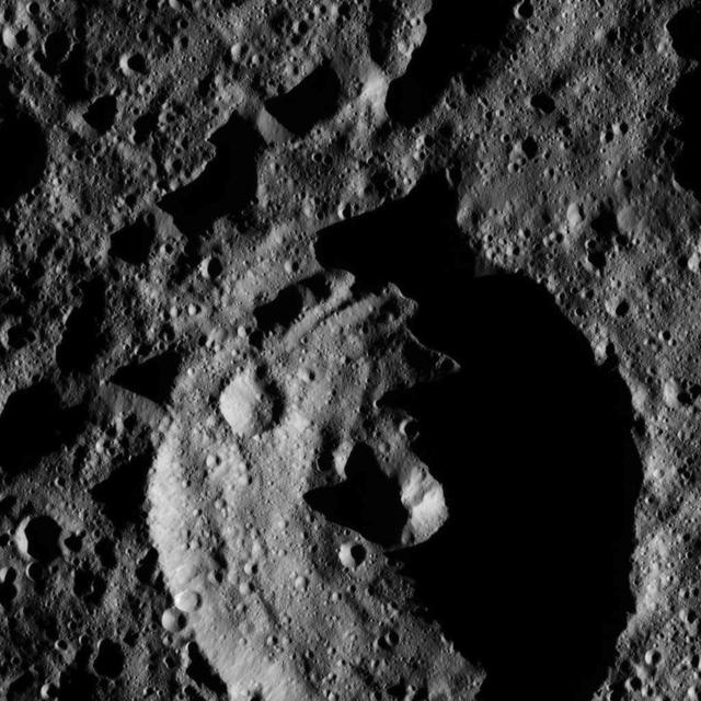 This view from NASA Dawn spacecraft shows a crater in the southern hemisphere of Ceres with a prominent central peak. The image is centered at approximately 63 degrees south latitude, 143 degrees east longitude. Dawn captured the scene on Dec. 24, 2015.
