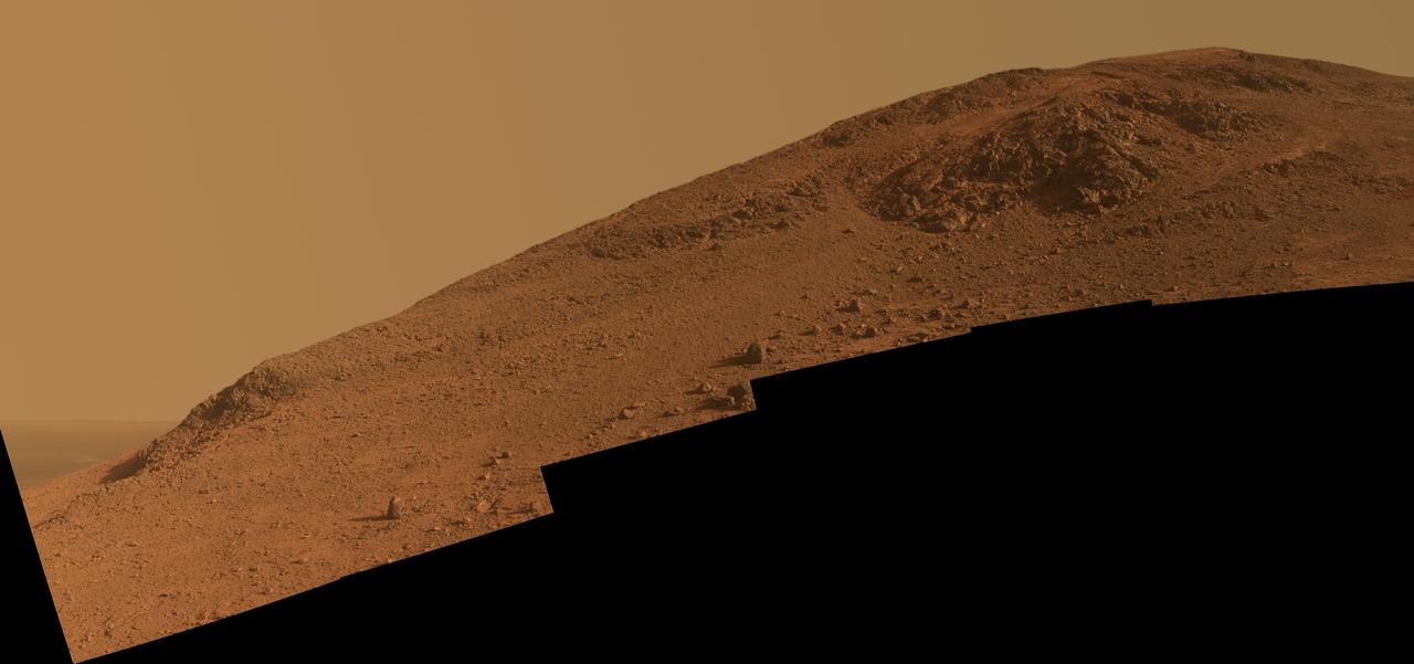 This scene from NASA Mars Exploration Rover Opportunity looks upward at Knudsen Ridge on the southern edge of Marathon Valley from inside the valley.