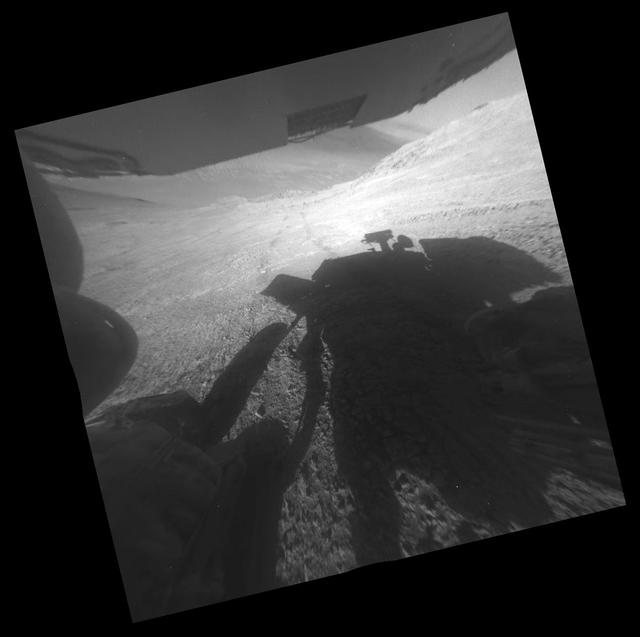 NASA image: Opportunity Shadow and Tracks on Martian Slope
