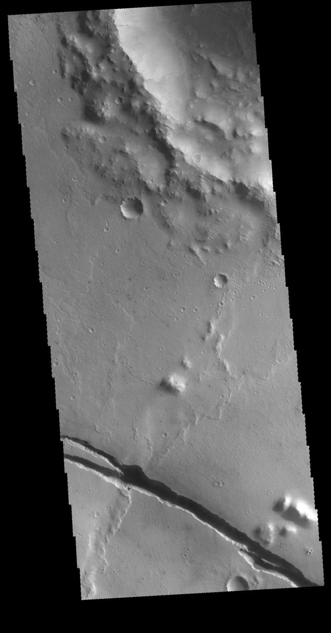 This image captured by NASA 2001 Mars Odyssey spacecraft shows a graben that is part of Cerberus Fossae.