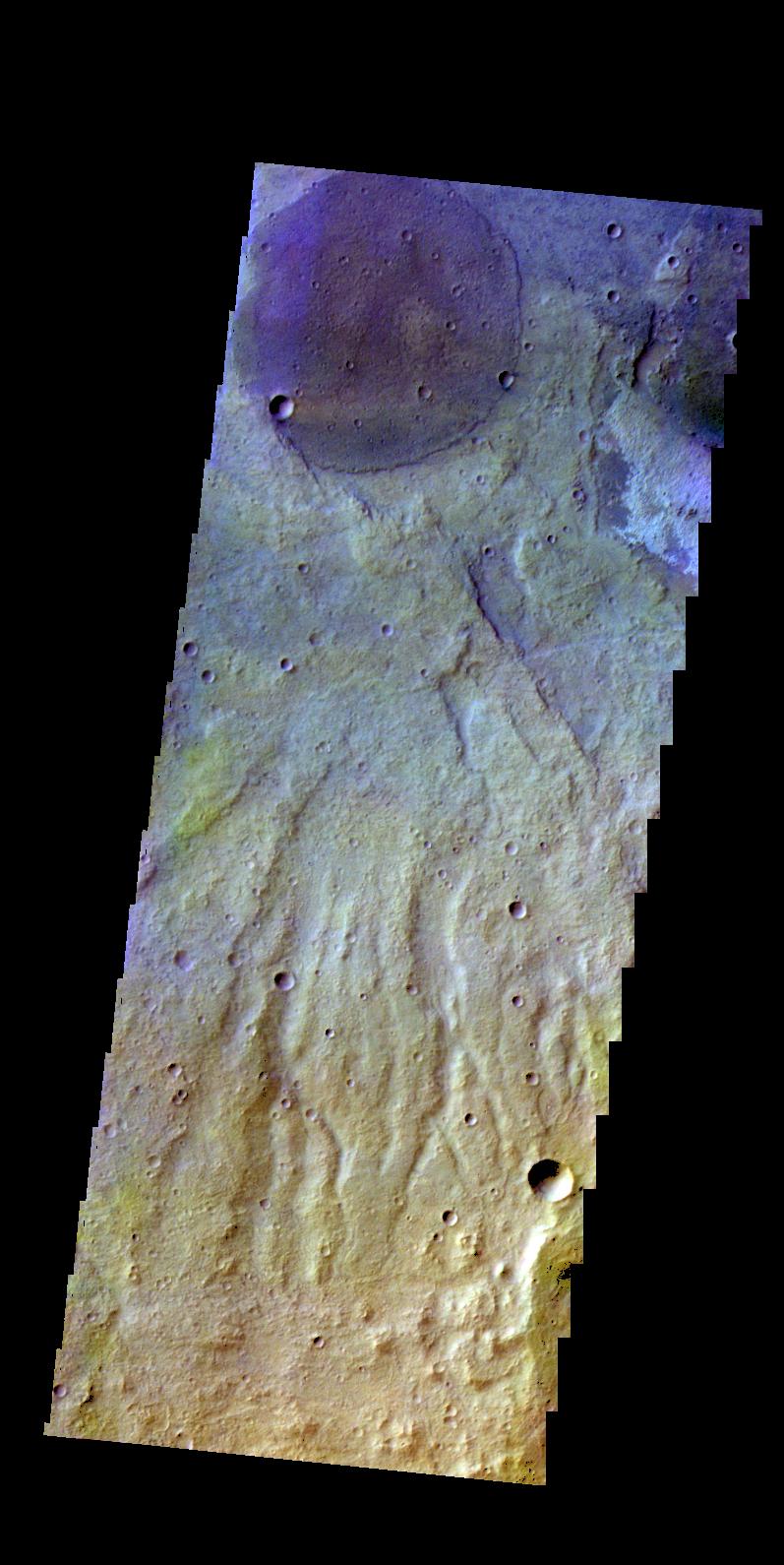 The THEMIS camera contains 5 filters. The data from different filters can be combined in multiple ways to create a false color image. This image from NASA 2001 Mars Odyssey spacecraft shows part of the plains of Terra Sirenum.