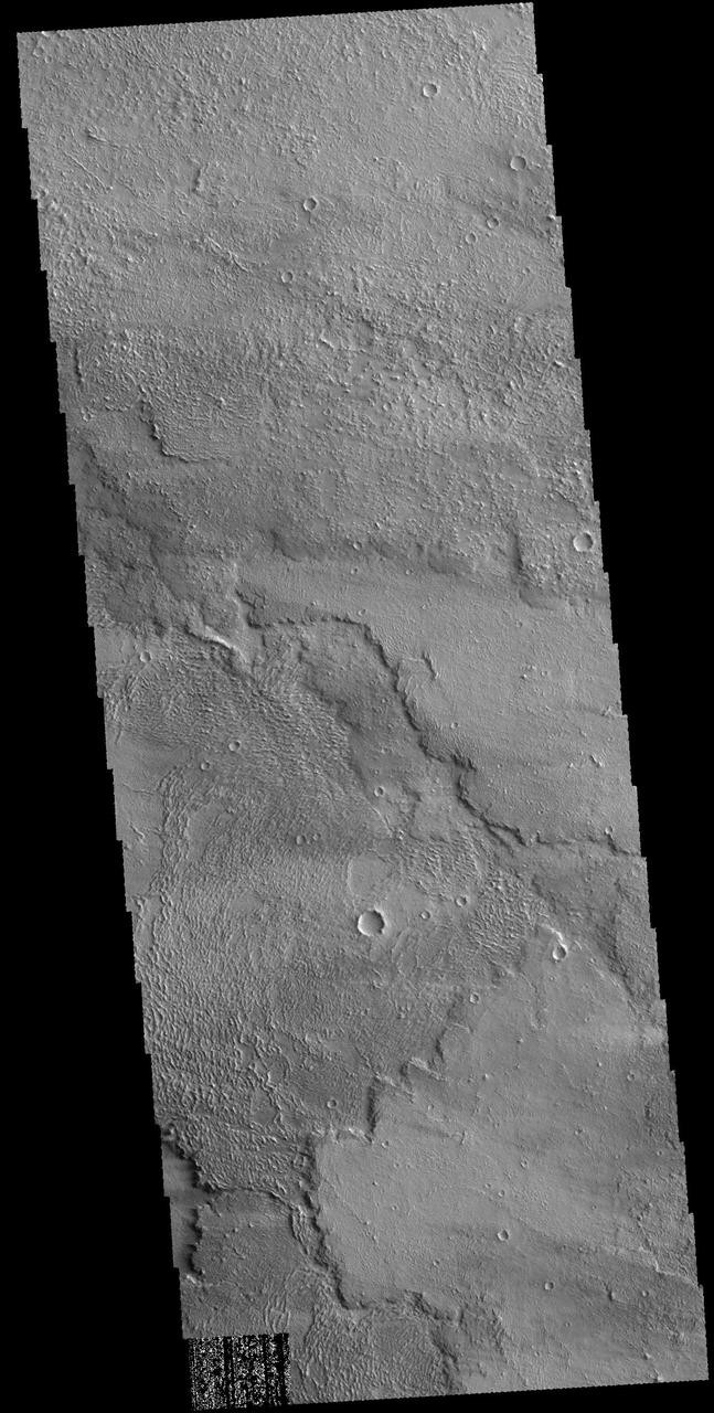 This image captured by NASA 2001 Mars Odyssey spacecraft shows part of the lava flows that originated from Arsia Mons.