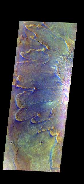 The THEMIS camera contains 5 filters. The data from different filters can be combined in multiple ways to create a false color image. This image from NASA 2001 Mars Odyssey spacecraft shows part of the ejecta from Yuty Crater.